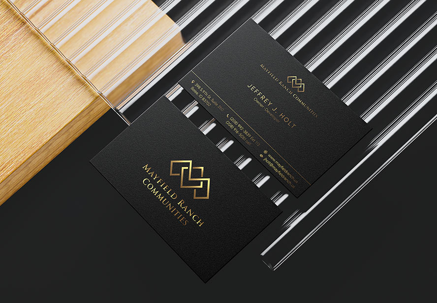 Mayfield Ranch Business Card – Elegant branding showcased with wood and glass elements, blending sophistication with natural aesthetics.