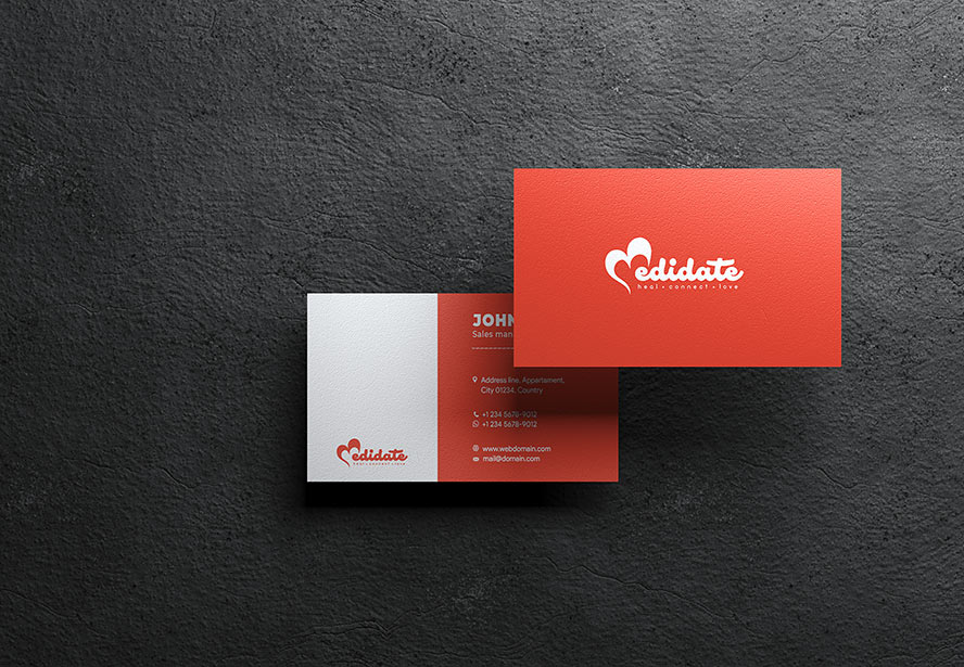 Medidate Business Card – Orange edition set against a dark concrete backdrop, emphasizing vibrancy and brand identity.